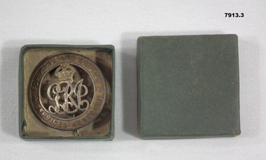 Silver War Badge with grey box.