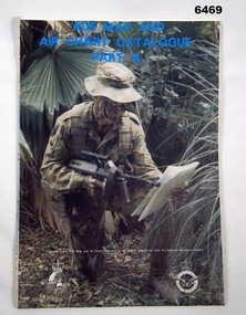 A map sheet folded into A4 size with a photo of a soldier reading a map on the cover