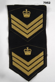 Two sets of Staff Sergeant Insignia in unused condition.