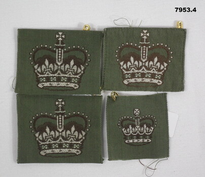 Four WO2 insignia featuring a Queen's Crown on a Khaki background.