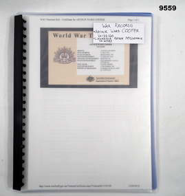 Plastic covered display folder containing war service records.