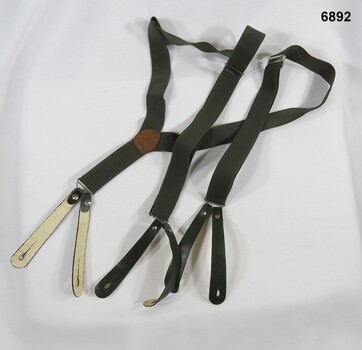 Elastic green braces, leather button holders, metal adjustments