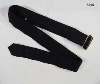 Gold Buckle on a Black Cotton Belt