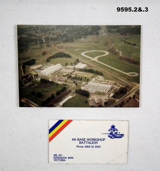 Aerial Photograph of buildings and a Business card.