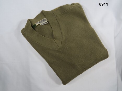 Khaki V-neck pullover with long sleeves.