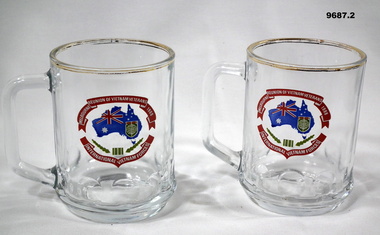 Pair of clear commemorative glasses with logo.