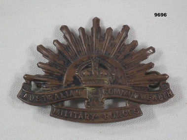 Copper Rising Sun hat badge.