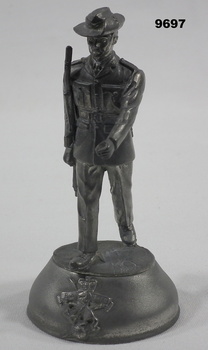 Small statue of a soldier in uniform.