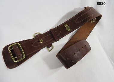 Brown leather Sam Browne belt.