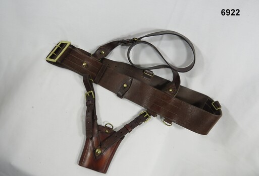 Brown leather Sam Browne belt.