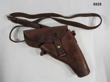 Pistol holster with shoulder strap.