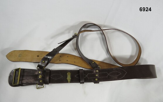 Brown leather Sam Browne belt.