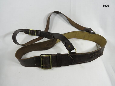 Brown leather Sam Browne belt.