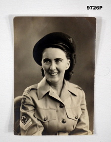 Black and white photograph of a lady in uniform.