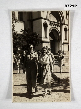 Black and white photograph of a lady and man in uniform.