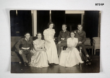 Black and white photograph of three couples at a Military ball.