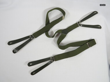 Braces, green, elastic shoulder adjustment and leather button holes.