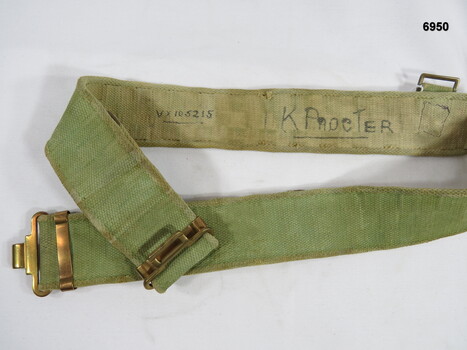 Khaki webbing belt with brass fittings.