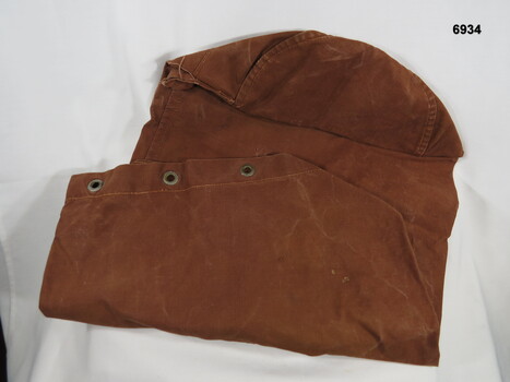 Dark brown long narrow duffle bag.