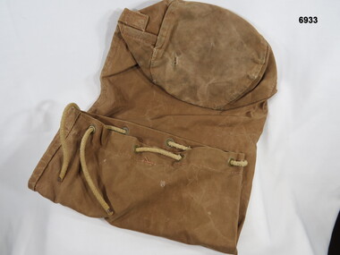 Light brown, long duffle bag.