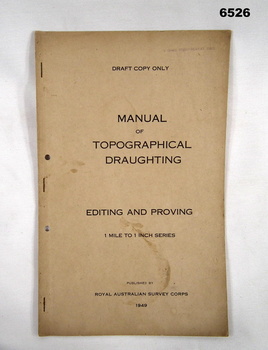 A foolscap sized buff coloured covered document, stapled and two hole punched