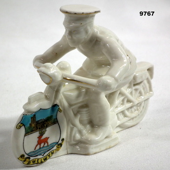 Ceramic model of motorcycle rider.