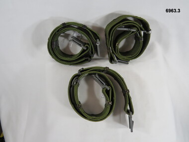 Three nylon, adjustable belt webbing with plastic buckles.