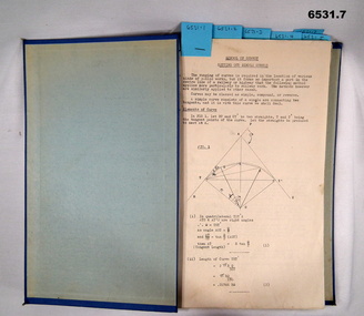 Blue Hard covered foolscap sized booklet held together with two Chicago screws