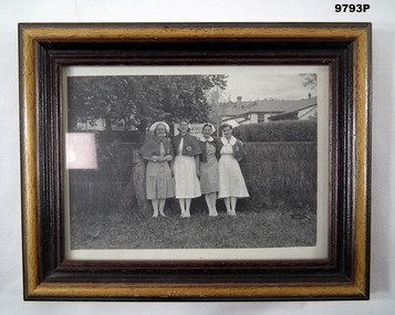 Photo of four nurses, framed WW2.