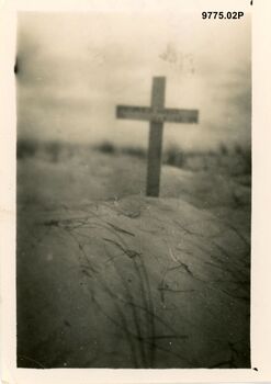 9775.02P Western Desert Alamein  One of the many lonely white crosses one keeps stumbling on this one of an unknown South African soldier