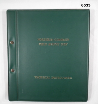 Green plastic covered manual of 68 x paper pages held together with Chicago screws