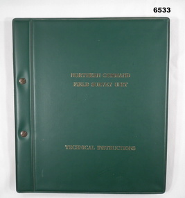 Green plastic covered manual of 68 x paper pages held together with Chicago screws