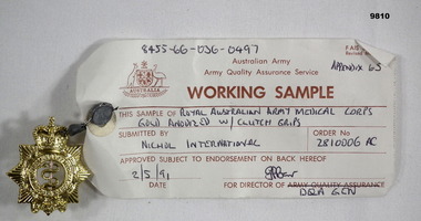 gold coloured badge of Royal Australian Army Medical Corps