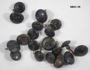 Collection of large and small Australian Army buttons.