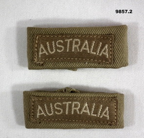"Australia" badge on cloth loop for epaulettes.