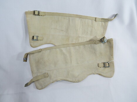 Webbing ankle gaiters with brass fittings.