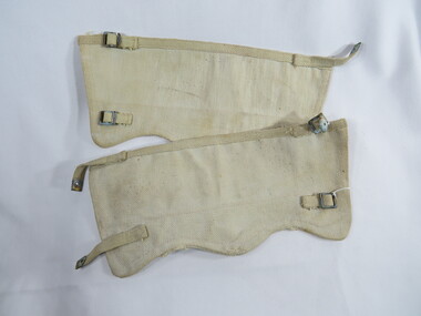 Webbing ankle gaiters with brass fittings.