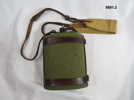 Felt covered blue enameled water bottle and harness.