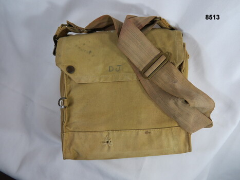 Khaki medical field bag carried over the shoulder.