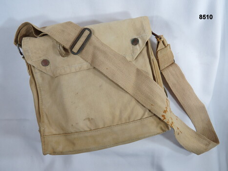 Khaki carry bag carried over the shoulder.