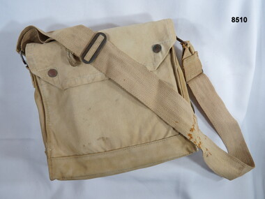 Khaki carry bag carried over the shoulder.