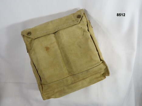 Khaki, over the shoulder carry pack.