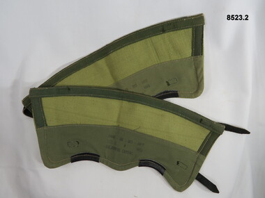 Pair of Khaki gaiters with leather straps and brass buckles.