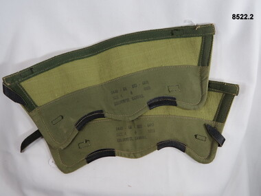 Pair Khaki gaiters with leather straps and brass buckles.