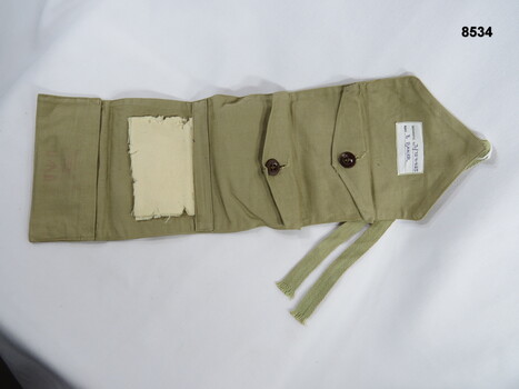 Khaki sewing kit for personal use.