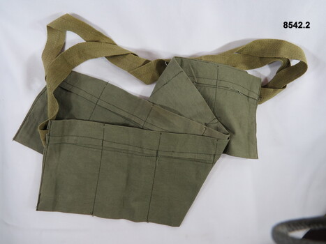 Green, seven pouch ammunition bandolier.