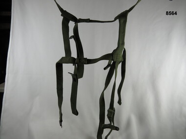 Army green, over the shoulder, webbing spider harness.