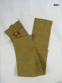 Narrow khaki holdall carry bag.