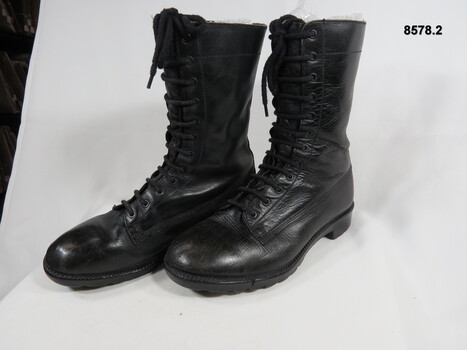 High sided black army boots.