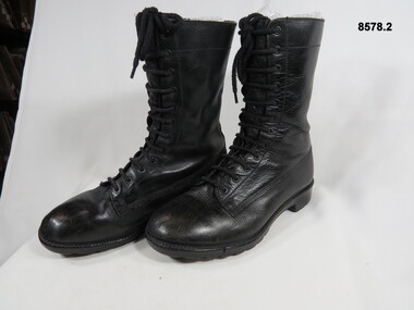 High sided black army boots.